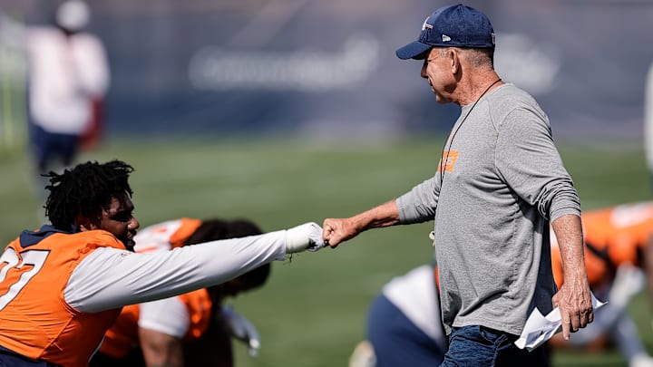 Jul 23, 2025; Englewood, CO, USA; Denver Broncos head coach Sean Payton and defensive tackle Malcolm Roach (97) during Denver Broncos Training Camp. 