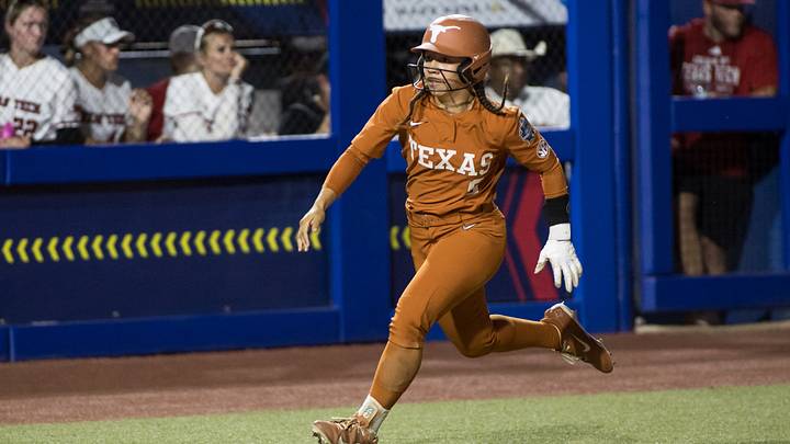 Jun 4, 2026; Oklahoma City, OK, USA; Texas Longhorns outfielder Alisa Sneed (9) runs towards home plate in the seventh inning against the Texas Tech Red Raiders during Game Two of the NCAA Women's College World Series championship series at Devon Park. Mandatory Credit: Brett Rojo-Imagn Images Jun 4, 2026; Oklahoma City, OK, USA; Texas Longhorns outfielder Alisa Sneed (9) runs towards home plate in the seventh inning against the Texas Tech Red Raiders during Game Two of the NCAA Women's College World Series championship series at Devon Park. Mandatory Credit: Brett Rojo-Imagn Images