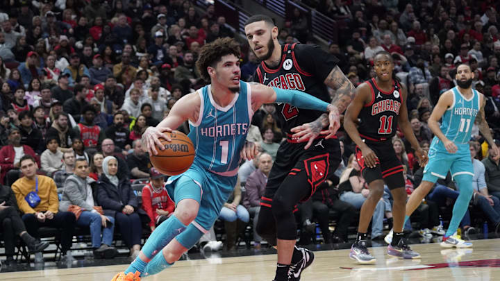 Jan 17, 2025; Chicago, Illinois, USA; Chicago Bulls guard Lonzo Ball (2) defends Charlotte Hornets guard LaMelo Ball (1) during the second half at United Center. Mandatory Credit: David Banks-Imagn Images