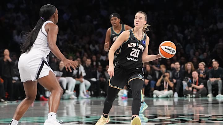 Sep 29, 2024; Brooklyn, New York, USA; New York Liberty guard Sabrina Ionescu (20) looks to pass the ball against the Las Vegas Aces during game one of the 2024 WNBA Semi-finals at Barclays Center. Mandatory Credit: Gregory Fisher-Imagn Images Sep 29, 2024; Brooklyn, New York, USA; New York Liberty guard Sabrina Ionescu (20) looks to pass the ball against the Las Vegas Aces during game one of the 2024 WNBA Semi-finals at Barclays Center. Mandatory Credit: Gregory Fisher-Imagn Images