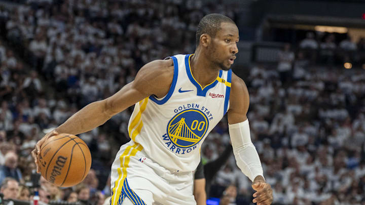 May 8, 2025; Minneapolis, Minnesota, USA; Golden State Warriors forward Jonathan Kuminga (00) dribbles the ball against the Minnesota Timberwolves in the second half during game two of the second round for the 2025 NBA Playoffs at Target Center. Mandatory Credit: Jesse Johnson-Imagn Images