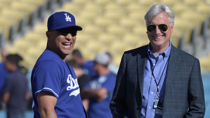 May 24, 2017; Los Angeles, CA, USA; Los Angeles Dodgers manager Dave Roberts (L) talks with Dodgers chief executive officer Mark Walter (R) prior to their game against the St. Louis Cardinals at Dodger Stadium. Mandatory Credit: Kirby Lee-Imagn Images