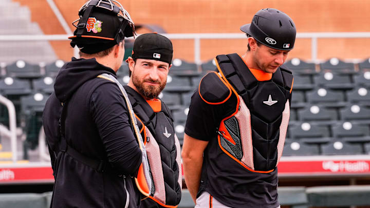 San Francisco Giants catchers Eric Haase (center) and Daniel Susac (right).