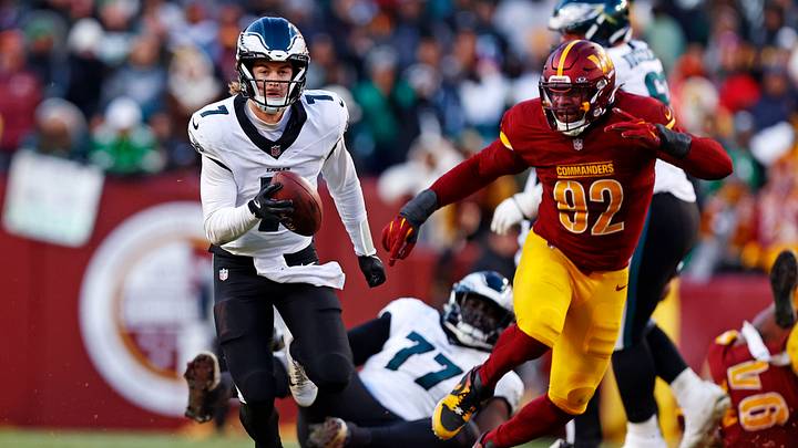 Landover, Maryland, USA; Philadelphia Eagles quarterback Kenny Pickett (7) runs the ball against Washington Commanders defensive end Dorance Armstrong (92) during the fourth quarter at Northwest Stadium. Mandatory Credit: Peter Casey-Imagn Images Landover, Maryland, USA; Philadelphia Eagles quarterback Kenny Pickett (7) runs the ball against Washington Commanders defensive end Dorance Armstrong (92) during the fourth quarter at Northwest Stadium. Mandatory Credit: Peter Casey-Imagn Images