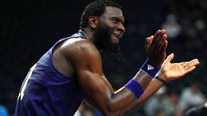 Nov 17, 2023; Las Vegas, Nevada, USA; Washington Huskies center Franck Kepnang (11) applauds after a play against the Xavier Musketeers during the second half at T-Mobile Arena. Mandatory Credit: Stephen R. Sylvanie-Imagn Images