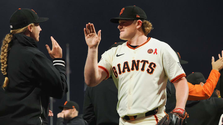 Jul 31, 2024; San Francisco, California, USA; San Francisco Giants starting pitcher Logan Webb high-fives major league coach Alyssa Nakken. Jul 31, 2024; San Francisco, California, USA; San Francisco Giants starting pitcher Logan Webb high-fives major league coach Alyssa Nakken.