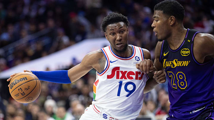 Jan 28, 2025; Philadelphia, Pennsylvania, USA; Philadelphia 76ers forward Justin Edwards (19) drives against Los Angeles Lakers forward Rui Hachimura (28) during the third quarter at Wells Fargo Center. Mandatory Credit: Bill Streicher-Imagn Images