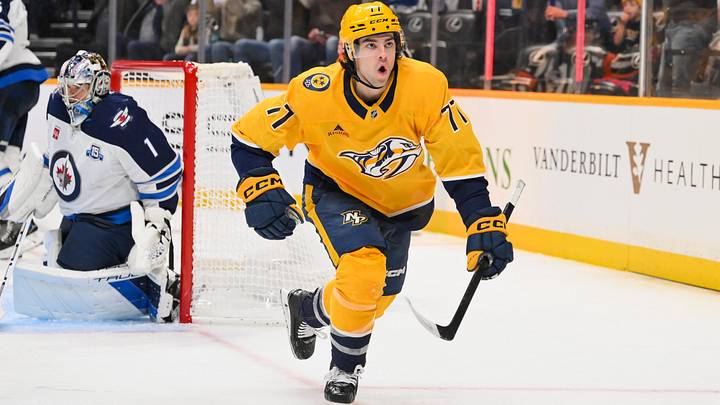 Nov 29, 2025; Nashville, Tennessee, USA; Nashville Predators right wing Luke Evangelista (77) reacts after scoring a goal against Winnipeg Jets goaltender Eric Comrie (1) during the third period at Bridgestone Arena. Nov 29, 2025; Nashville, Tennessee, USA; Nashville Predators right wing Luke Evangelista (77) reacts after scoring a goal against Winnipeg Jets goaltender Eric Comrie (1) during the third period at Bridgestone Arena.