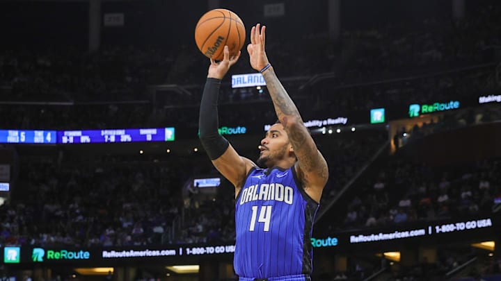 Dec 27, 2024; Orlando, Florida, USA; Orlando Magic guard Gary Harris (14) shoots during the second half against the New York Knicks at Kia Center. Mandatory Credit: Mike Watters-Imagn Images