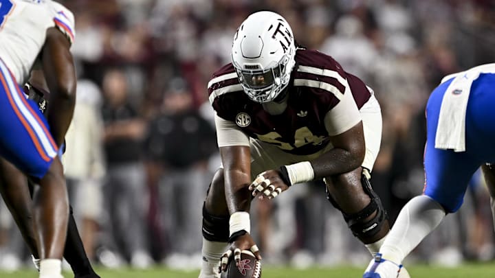 Texas A&M Aggies offensive lineman Mark Nabou Jr. (54) sets the ball during the fourth quarter against the Florida Gators at Kyle Field. 