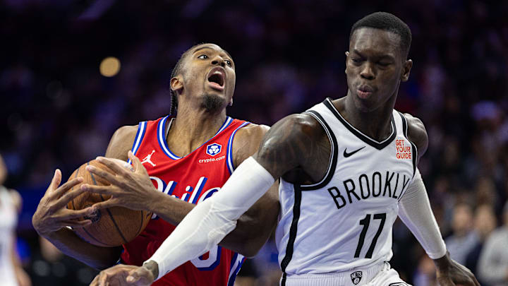 Nov 22, 2024; Philadelphia, Pennsylvania, USA; Philadelphia 76ers guard Tyrese Maxey (0) drives against Brooklyn Nets guard Dennis Schroder (17) during the fourth quarter at Wells Fargo Center. Mandatory Credit: Bill Streicher-Imagn Images