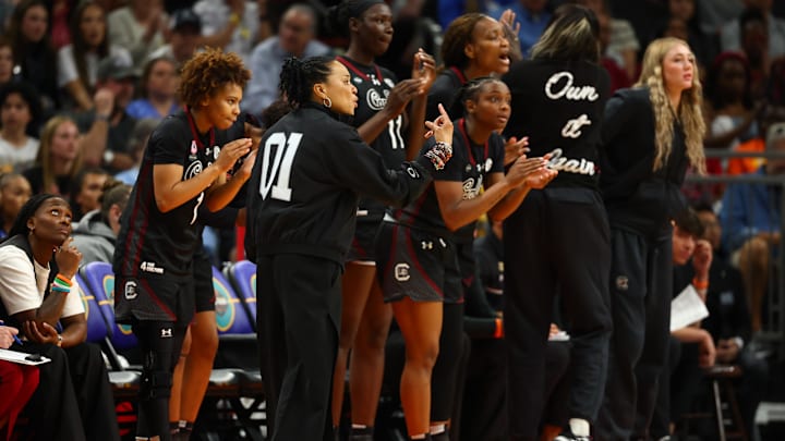 Apr 5, 2026; Phoenix, AZ, USA; South Carolina Gamecocks head coach Dawn Staley and the bench react in the third quarter against the UCLA Bruins during the National Championship game of the women's 2026 NCAA Tournament at Mortgage Matchup Center. Mandatory Credit: Mark J. Rebilas-Imagn Images