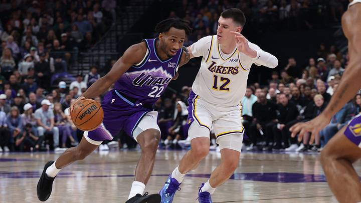 Oct 25, 2026; Salt Lake City, Utah, USA;  Utah Jazz guard Darryn Peterson (22) drives against Los Angeles Lakers forward Jake LaRavia (12) during the second half at Delta Center.  Mandatory Credit: Rob Gray-Imagn Images
