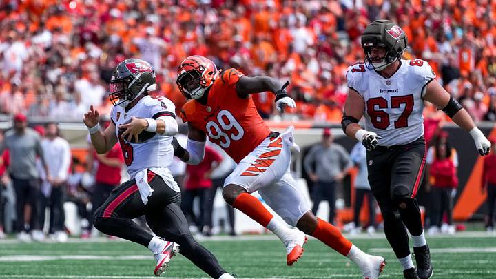 Tampa Bay Buccaneers quarterback Baker Mayfield (6) runs from Cincinnati Bengals defensive end Myles Murphy (99) before fumbling in the second quarter of the NFL Week 1 game between the Cincinnati Bengals and the Tampa Bay Buccaneers at Paycor Stadium in Cincinnati on Sunday, Sept. 13, 2026. Tampa Bay Buccaneers quarterback Baker Mayfield (6) runs from Cincinnati Bengals defensive end Myles Murphy (99) before fumbling in the second quarter of the NFL Week 1 game between the Cincinnati Bengals and the Tampa Bay Buccaneers at Paycor Stadium in Cincinnati on Sunday, Sept. 13, 2026.