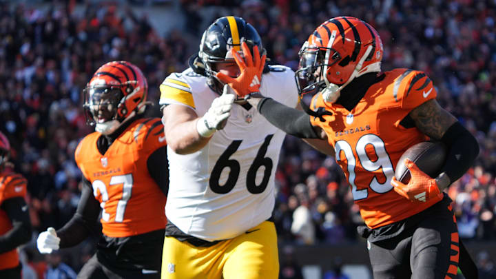 Bengals Cam Taylor-Britt (29) intercepts the ball and runs it back for a Bengals touchdown during their game against the Steelers at Paycor Stadium on Sunday December 1, 2024. Steelers lead the game at halftime with a score of 27-21.