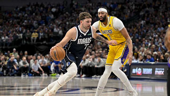 Dec 12, 2023; Dallas, Texas, USA; Dallas Mavericks guard Luka Doncic (77) drives to the basket past Los Angeles Lakers forward Anthony Davis (3) during the second half at the American Airlines Center. Mandatory Credit: Jerome Miron-Imagn Images