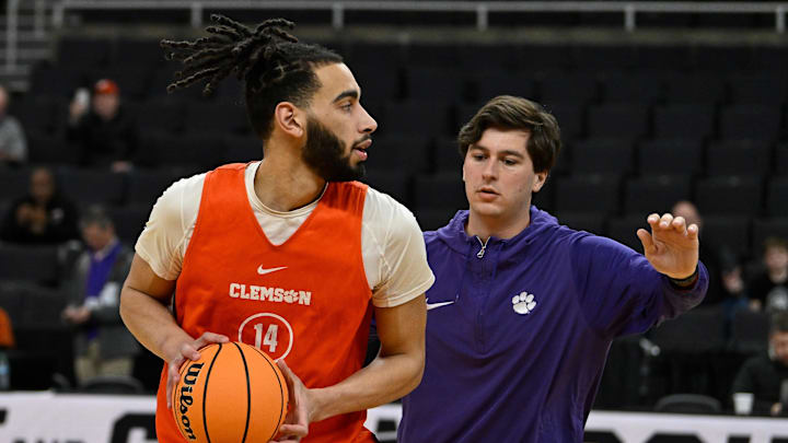 Mar 19, 2025; Providence, RI, USA; Clemson Tigers center Christian Reeves (14) works with a coaching assistant at a practice at Amica Mutual Pavilion. Mandatory Credit: Eric Canha-Imagn Images