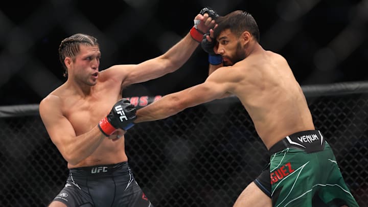 Jul 16, 2022; Elmont, New York, USA; Brian Ortega (red gloves) fights Yair Rodriguez (blue gloves)