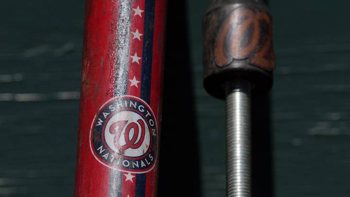 Aug 10, 2025; San Francisco, California, USA; The Washington Nationals logo appears on a fungo bat in the dugout before the game against the San Francisco Giants at Oracle Park. Mandatory Credit: Darren Yamashita-Imagn Images