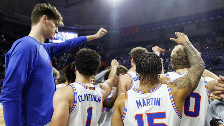 Florida Gators guard Walter Clayton Jr. (1) and center Olivier Rioux (32)