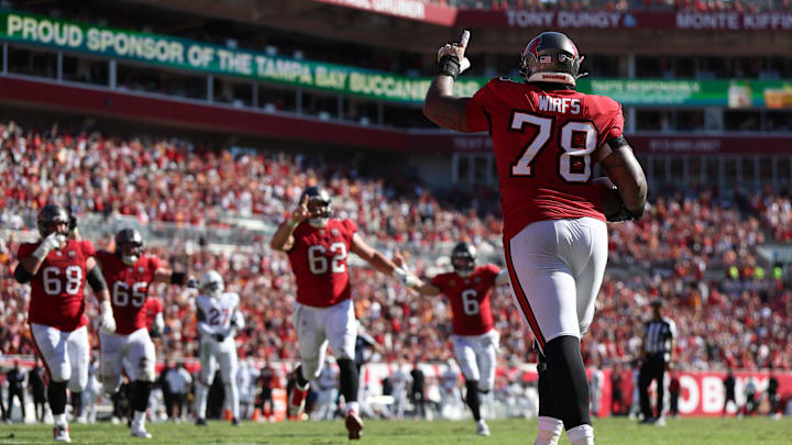 Nov 30, 2025; Tampa, Florida, USA; Tampa Bay Buccaneers offensive tackle Tristan Wirfs (78) celebrates with teammates after scoring a touchdown during the first half against the Arizona Cardinals at Raymond James Stadium. Mandatory Credit: Nathan Ray Seebeck-Imagn Images