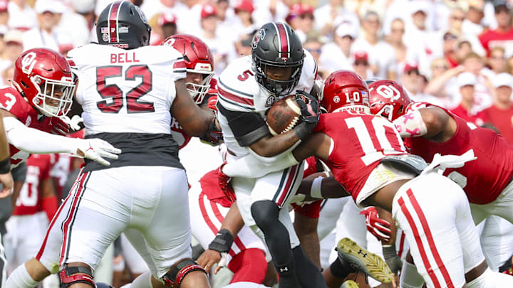 South Carolina Gamecocks running back Raheim Sanders (5) runs with the ball as Oklahoma Sooners linebacker Kip Lewis (10) defends.
