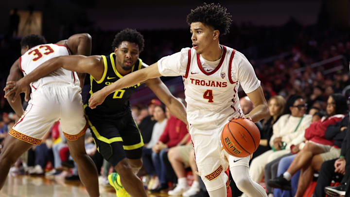 Feb 1, 2024; Los Angeles, California, USA; USC Trojans guard Oziyah Sellers (4) drives to the basket against Oregon Ducks guard Kario Oquendo (0) during the first half at Galen Center. Mandatory Credit: Kiyoshi Mio-Imagn Images Feb 1, 2024; Los Angeles, California, USA; USC Trojans guard Oziyah Sellers (4) drives to the basket against Oregon Ducks guard Kario Oquendo (0) during the first half at Galen Center. Mandatory Credit: Kiyoshi Mio-Imagn Images