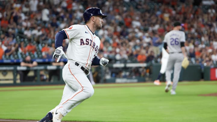Jun 25, 2024; Houston, Texas, USA; Houston Astros third baseman Alex Bregman (2) hits a RBI single against Colorado Rockies starting pitcher Austin Gomber (26)  in the first inning at Minute Maid Park. Mandatory Credit: Thomas Shea-USA TODAY Sports