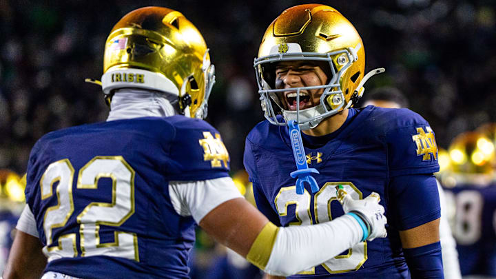 Nov 22, 2025; South Bend, Indiana, USA; Notre Dame Fighting Irish safety Ethan Long (22) celebrates an interception with cornerback Cree Thomas, right, during the second half at Notre Dame Stadium. Mandatory Credit: Michael Caterina-Imagn Images Nov 22, 2025; South Bend, Indiana, USA; Notre Dame Fighting Irish safety Ethan Long (22) celebrates an interception with cornerback Cree Thomas, right, during the second half at Notre Dame Stadium. Mandatory Credit: Michael Caterina-Imagn Images