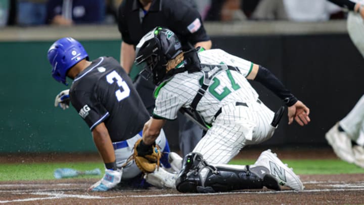 IMG Academy's Kelvyn Paulino (3) slides home as South Walton catcher Hudson Quinn (27) applies the tag. South Walton defeated IMG Academy 7-6. 