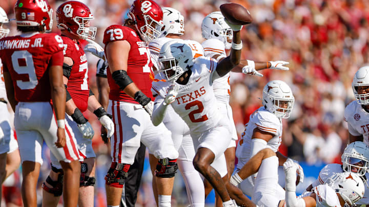Oct 12, 2024; Dallas, Texas, USA; Texas Longhorns defensive back Derek Williams Jr. (2) recovers a fumble during the second quarter against the Oklahoma Sooners at the Cotton Bowl. Mandatory Credit: Andrew Dieb-Imagn Images Oct 12, 2024; Dallas, Texas, USA; Texas Longhorns defensive back Derek Williams Jr. (2) recovers a fumble during the second quarter against the Oklahoma Sooners at the Cotton Bowl. Mandatory Credit: Andrew Dieb-Imagn Images