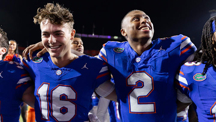 Oct 19, 2024; Gainesville, Florida, USA; Florida Gators quarterback Aidan Warner (16) and Florida Gators quarterback DJ Lagway (2) smile after a game against the Kentucky Wildcats at Ben Hill Griffin Stadium. Mandatory Credit: Matt Pendleton-Imagn Images
