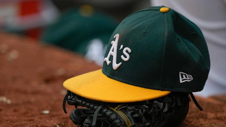 Jun 30, 2021; Oakland, California, USA; General view of the Oakland Athletics hat and glove during the third inning against the Texas Rangers at RingCentral Coliseum. Mandatory Credit: Stan Szeto-Imagn Images Jun 30, 2021; Oakland, California, USA; General view of the Oakland Athletics hat and glove during the third inning against the Texas Rangers at RingCentral Coliseum. Mandatory Credit: Stan Szeto-Imagn Images