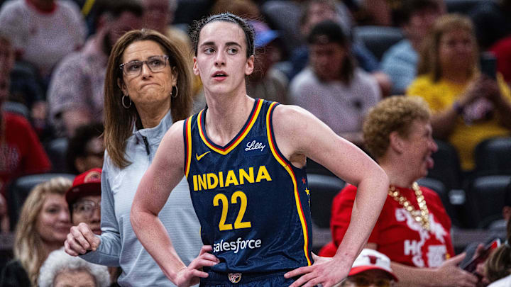 Jun 17, 2025; Indianapolis, Indiana, USA; Indiana Fever guard Caitlin Clark (22)  and head coach Stephanie White in the first half against the Connecticut Sun at Gainbridge Fieldhouse. Mandatory Credit: Trevor Ruszkowski-Imagn Images