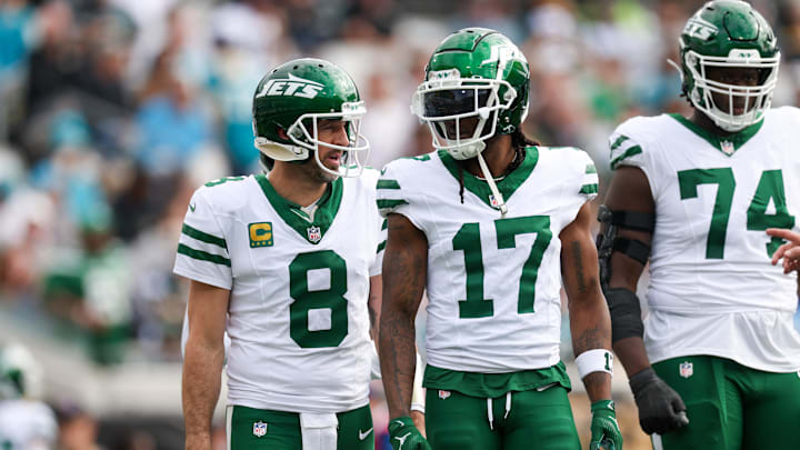 Dec 15, 2024; Jacksonville, Florida, USA; New York Jets quarterback Aaron Rodgers (8) and wide receiver Davante Adams (17) was out to the field after a turnover against the Jacksonville Jaguars in the first quarter at EverBank Stadium. Mandatory Credit: Nathan Ray Seebeck-Imagn Images Dec 15, 2024; Jacksonville, Florida, USA; New York Jets quarterback Aaron Rodgers (8) and wide receiver Davante Adams (17) was out to the field after a turnover against the Jacksonville Jaguars in the first quarter at EverBank Stadium. Mandatory Credit: Nathan Ray Seebeck-Imagn Images
