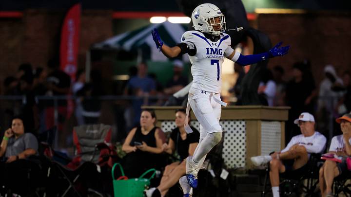 IMG Academy's Jayden Wade (7) gloats on a touchdown score to the Mandarin Mustangs fans during the second quarter of a high school football matchup at Mandarin High School, Friday, Sept. 19, 2025, in Jacksonville, Fla. The IMG Academy Ascenders defeated the Mandarin Mustangs 57-7.