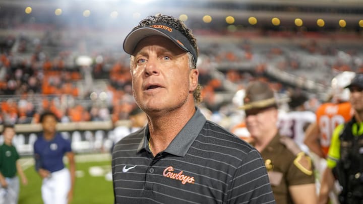 Oklahoma State head coach Mike Gundy walks off the field Oklahoma State head coach Mike Gundy walks off the field
