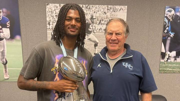 Kamil Loud and Bill Belichick share a recruiting moment. 