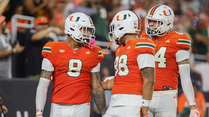 Sep 27, 2024; Miami Gardens, Florida, USA; Miami Hurricanes tight end Elijah Arroyo (8) celebrates with tight end Riley Williams (88) after scoring a touchdown against the Virginia Tech Hokies during the first quarter at Hard Rock Stadium. Mandatory Credit: Sam Navarro-Imagn Images Sep 27, 2024; Miami Gardens, Florida, USA; Miami Hurricanes tight end Elijah Arroyo (8) celebrates with tight end Riley Williams (88) after scoring a touchdown against the Virginia Tech Hokies during the first quarter at Hard Rock Stadium. Mandatory Credit: Sam Navarro-Imagn Images