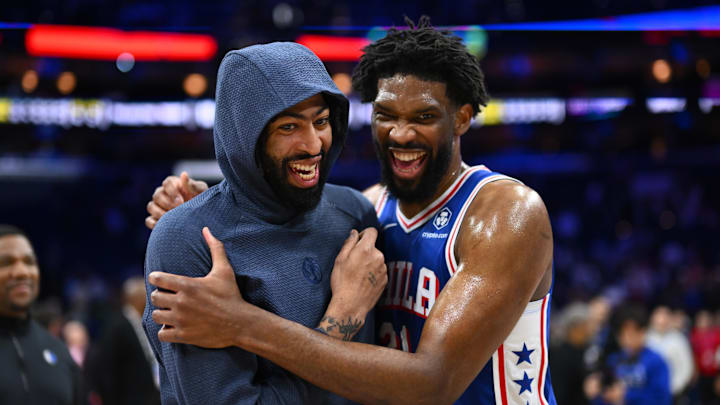 Feb 4, 2025; Philadelphia, Pennsylvania, USA; Dallas Mavericks forward Anthony Davis (3) reacts with Philadelphia 76ers center Joel Embiid (21) after the game at Wells Fargo Center. Mandatory Credit: Kyle Ross-Imagn Images