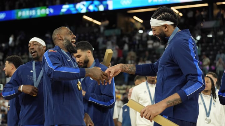 Aug 10, 2024; Paris, France; United States forward LeBron James (6) and center Anthony Davis (14) celebrate after defeating France in the men's basketball gold medal game during the Paris 2024 Olympic Summer Games at Accor Arena. Mandatory Credit: Kyle Terada-USA TODAY Sports Aug 10, 2024; Paris, France; United States forward LeBron James (6) and center Anthony Davis (14) celebrate after defeating France in the men's basketball gold medal game during the Paris 2024 Olympic Summer Games at Accor Arena. Mandatory Credit: Kyle Terada-USA TODAY Sports