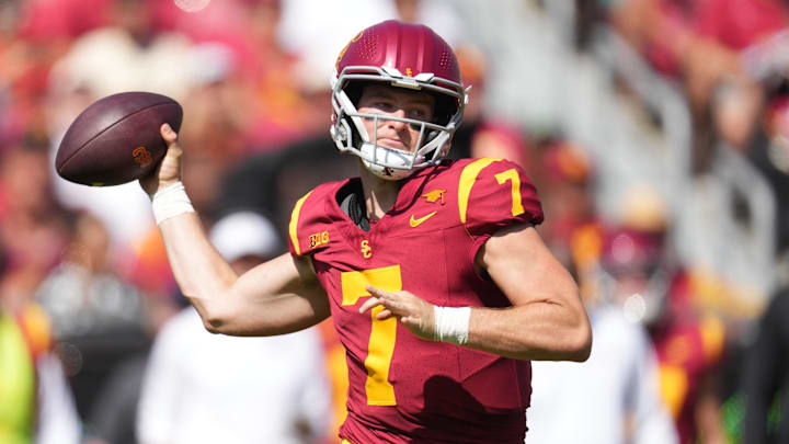 Sep 28, 2024; Los Angeles, California, USA; Southern California Trojans quarterback Miller Moss (7) throws the ball against the Wisconsin Badgers in the first half at United Airlines Field at Los Angeles Memorial Coliseum. Mandatory Credit: Kirby Lee-Imagn Images
