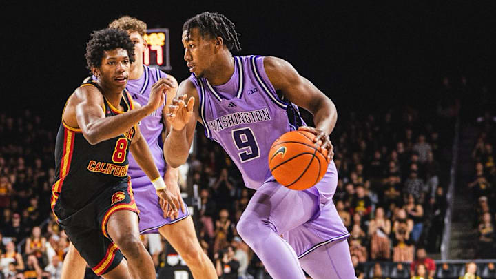 Wesley Yates III, in a lavender UW uniform, drives to the basket at USC. Wesley Yates III, in a lavender UW uniform, drives to the basket at USC.