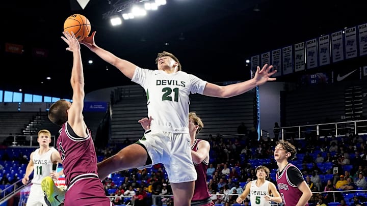 Greeneville's Trey Thompson (21) fights for the rebound with Munford's Elisha Patrick (1) during the third quarter of a TSSAA Class 3A basketball state quarterfinal game at Murphy Center in Murfreesboro, Tenn., Thursday, March 20, 2025. Greeneville's Trey Thompson (21) fights for the rebound with Munford's Elisha Patrick (1) during the third quarter of a TSSAA Class 3A basketball state quarterfinal game at Murphy Center in Murfreesboro, Tenn., Thursday, March 20, 2025.