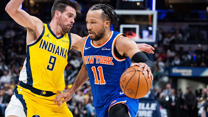 Mar 13, 2026; Indianapolis, Indiana, USA;  New York Knicks guard Jalen Brunson (11) dribbles the ball while Indiana Pacers guard T.J. McConnell (9) defends in the second half at Gainbridge Fieldhouse. Mandatory Credit: Trevor Ruszkowski-Imagn Images