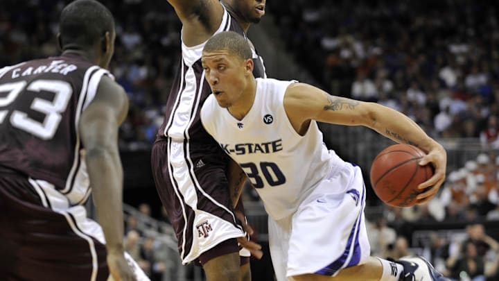 March 14, 2008; Kansas City, MO, USA; Kansas State Wildcats forward Michael Beasley (30) drives around Texas A&M Aggies forward Joseph Jones (30) in the first half during the 2008 Big Twelve Mens Basketball Tournament at the Sprint Center. Texas A&M defeated Kansas State 63-60. Mandatory Credit: Peter G. Aiken-Imagn Images