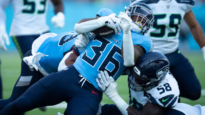 Tennessee Titans running back Julius Chestnut (36) runs against Seattle Seahawks linebacker Derick Hall (58) during their game at Nissan Stadium in Nashville, Tenn., Saturday, Aug. 17, 2024. Tennessee Titans running back Julius Chestnut (36) runs against Seattle Seahawks linebacker Derick Hall (58) during their game at Nissan Stadium in Nashville, Tenn., Saturday, Aug. 17, 2024.