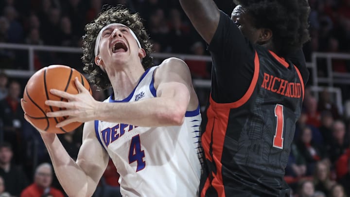 DePaul Blue Demons guard Conor Enright (4) looks to post up against St. John's Red Storm guard Kadary Richmond (1) at Carnesecca Arena.