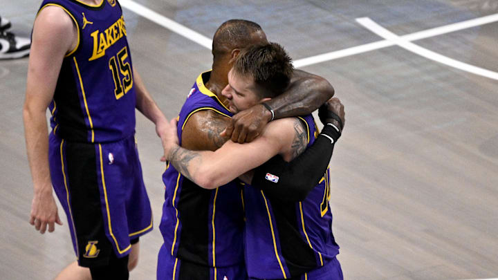 Apr 9, 2025; Dallas, Texas, USA; Los Angeles Lakers guard Luka Doncic (77) and forward LeBron James (23) celebrate during the fourth quarter against the Dallas Mavericks at the American Airlines Center. Mandatory Credit: Jerome Miron-Imagn Images Apr 9, 2025; Dallas, Texas, USA; Los Angeles Lakers guard Luka Doncic (77) and forward LeBron James (23) celebrate during the fourth quarter against the Dallas Mavericks at the American Airlines Center. Mandatory Credit: Jerome Miron-Imagn Images