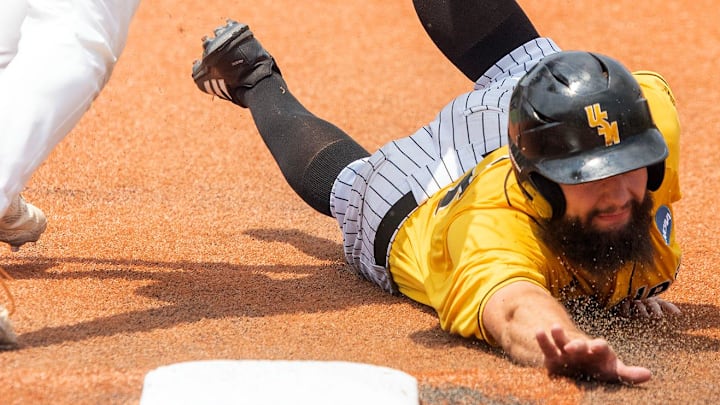 Southern Mississippi's Matthew Etzel (3) is picked off at first by Tennessee's Blake Burke  (25) on a throw from the pitcher during Game 1 of the NCAA Hattiesburg Super Regional in Hattiesburg, Mississippi.